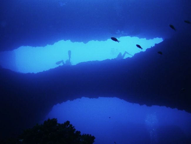 Malta Divers going through a hole
