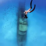 Diving Down beautiful blue Sea to a wreck in Malta