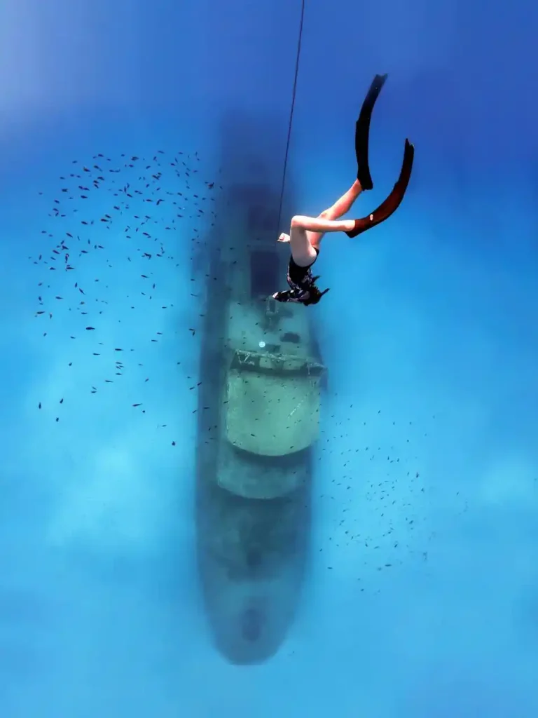 Diving Down beautiful blue Sea to a wreck in Malta