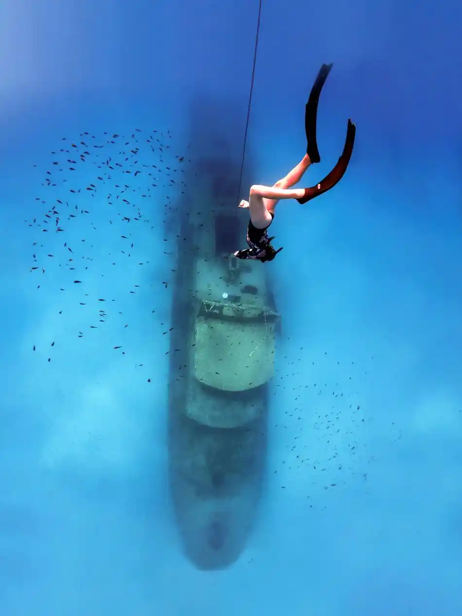 Diving Down beautiful blue Sea to a wreck in Malta