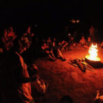 Equinox Malta Celebrating around a campfire