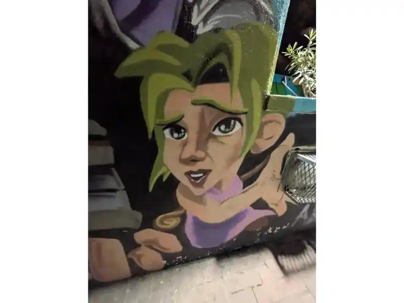 A sad looking young girl, Malta street Art