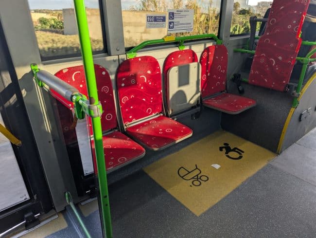 A bus in Malta offering aqueduct space for Buggies and people who need assistance.