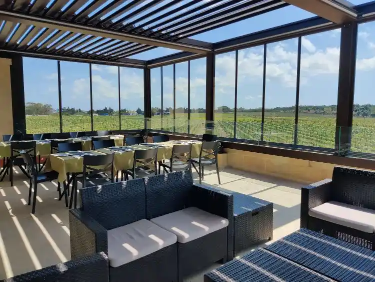 Enclosed terrace at Meridiana Wine Estate with seating overlooking the vineyards near Mdina, Malta