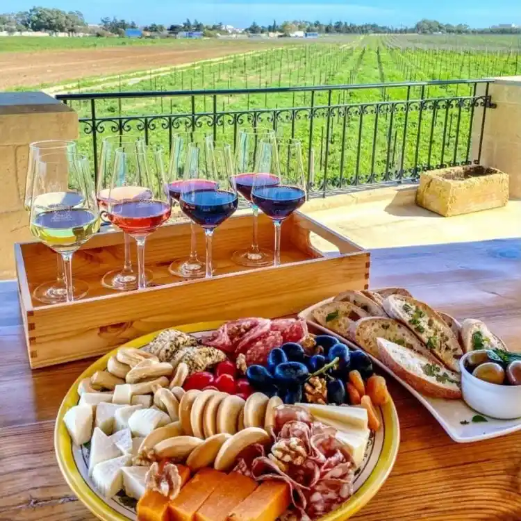 Maltese food platter with local meats, cheeses, bread and olives served during a wine tasting at Meridiana Wine Estate, Malta