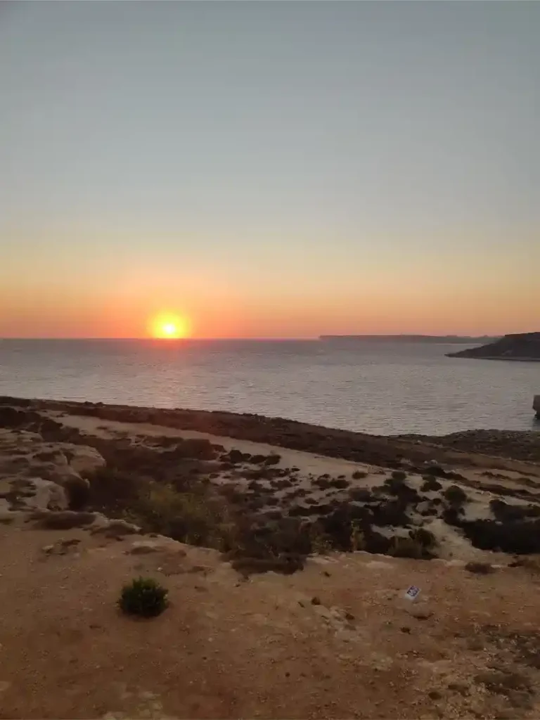 Sunset from a rocky beach near Il-Majjistral Nature Park Malta
