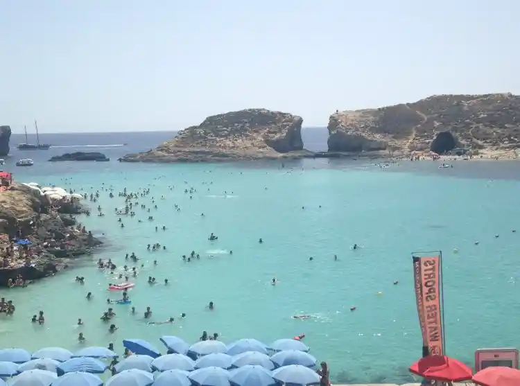 Cominotto opposite Comino, in between blue lagoon.