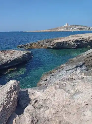 Rocky Beach Malta August Cyan blue