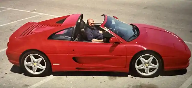 A red Ferrari F355 Spider, the open-top version of Ferrari’s mid-engined V8 sports car, photographed in Malta, likely in the late 1990s or early 2000s.