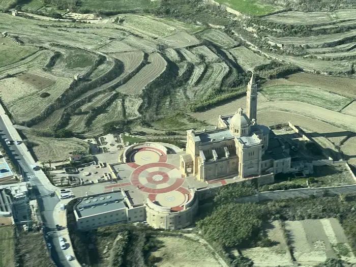 The Basilica of Ta' Pinu in Gozo seen from the air, with terraced fields around it